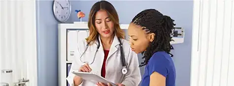 doctor nurse reviewing chart